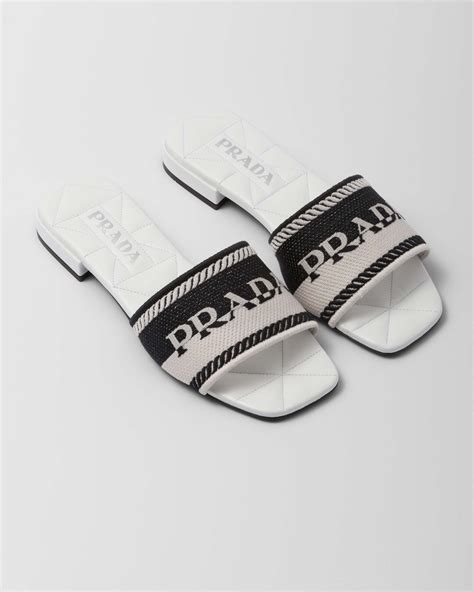 black and white Prada slides